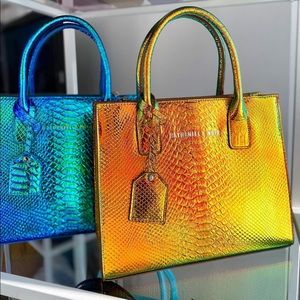 Noir X by Nathaniel Noir. Liquid Gold Python medium.